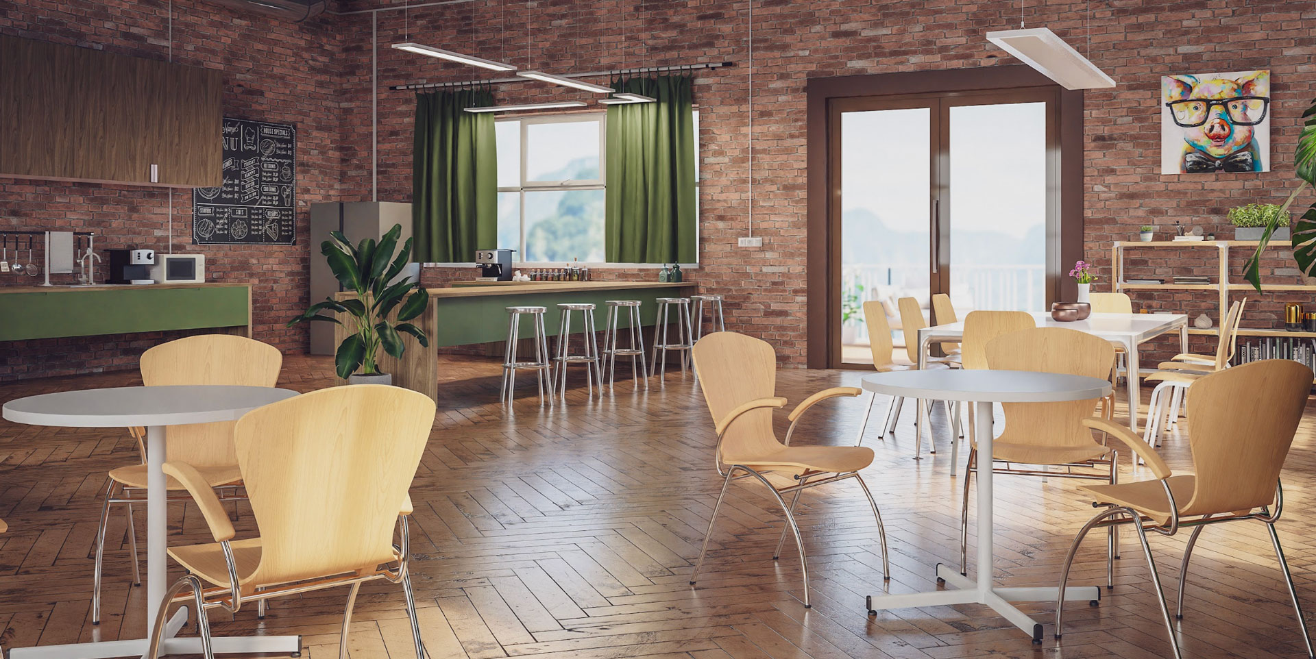 Ein modern gestalteter Pausenraum mit Ziegelwand, Holzboden und einer Mischung aus runden und eckigen Tischen.